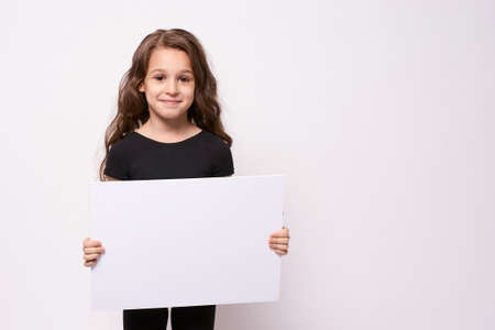 Little girl. Light background. White list.の写真素材