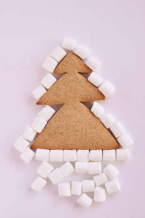 Christmas tree biscuits. White marshmallow. Light background. Delicious dessert.の写真素材