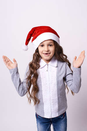 Pretty Girl. Christmas hat. White background.の写真素材