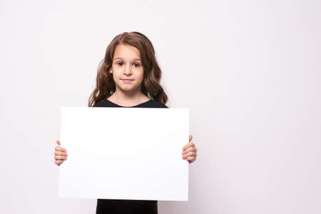 Little girl. White list. Light background.の写真素材