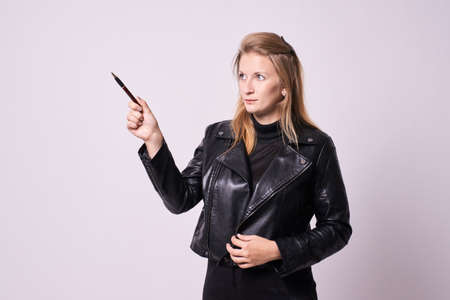 Direction upwards. Beautiful girl. White background.の写真素材