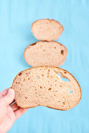 Unusual tree. Three slices bread. Blue background.の写真素材