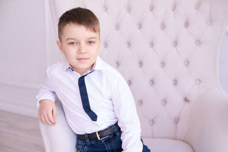 Little boy. Beautiful portrait. Bright interior.の写真素材