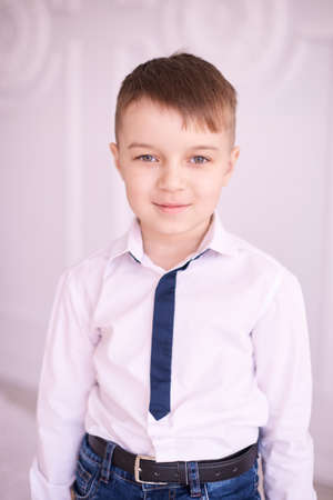 Little boy. White shirt. Light background.の写真素材