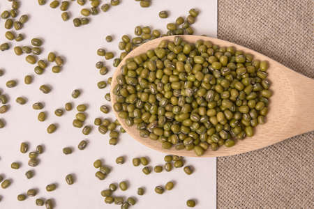Green beans. Wooden spoon. White background. Healthy Eating.の写真素材