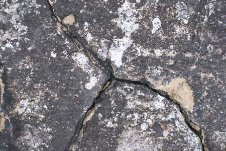 Dark cement surface. Large crack in concrete.の写真素材