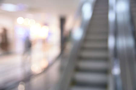 Blurred background. Shopping center.  Gray escalator.の写真素材