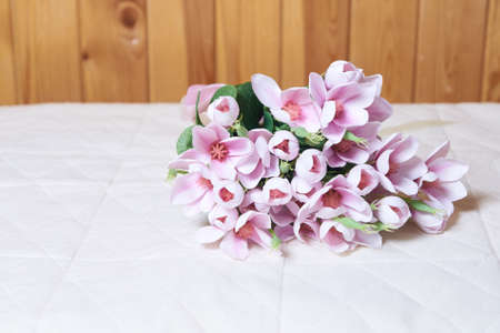 Bouquet of artificial flowers. Gentle colors. Light background.の写真素材