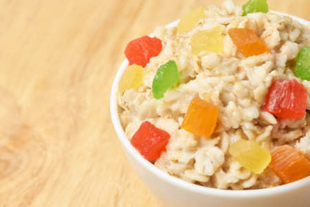 Bright colors. Oatmeal with dried fruits. Useful breakfast.の写真素材