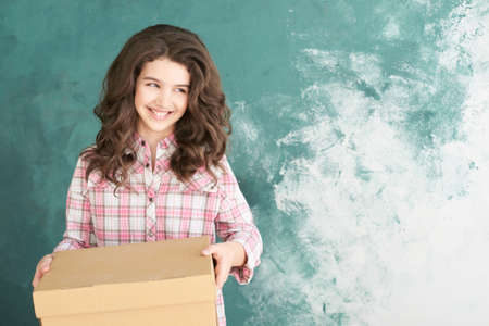 Beautiful young girl with relocation boxの写真素材
