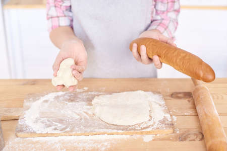 Preparation of test. White flour. Wooden table. Ready made pastry.の写真素材