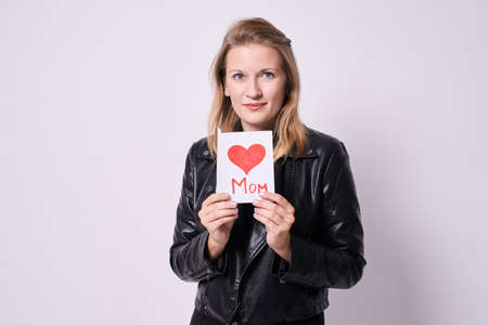 Young girl. Bright drawing. Red heart. Light background.の写真素材