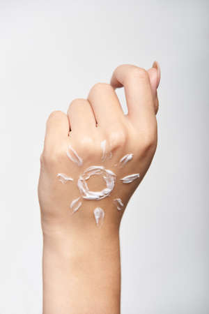 Sunscreen skin cream woman. Skincare tan girl.の写真素材