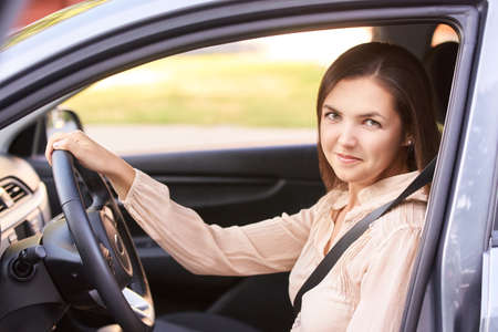 Young girl face. Rental car driver. buying new jeep.の写真素材