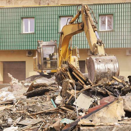 Demolition house. Building renovation at city. Industrial breaker.の写真素材