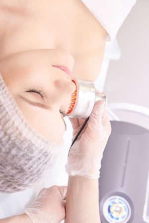 Light therapy procedure. Heal beauty treatment. Woman facial device. Anti age and wrinkle.
