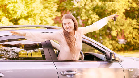 Happy new driver. Young person girl. Insurance vehicle.
