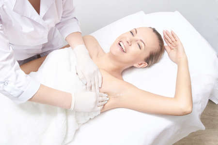 Waxing woman leg. Sugar hair removal. laser service epilation. Salon wax beautician procedure.の写真素材