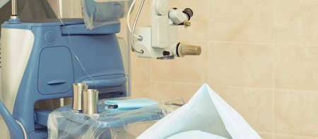 Ophthalmology laser microscope operation. Clinic room with doctor and parient. Gloves and medicine...