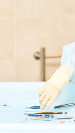 Ophthalmology laser microscope operation. Clinic room with doctor and parient. Gloves and medicine tools. Defocused.の写真素材