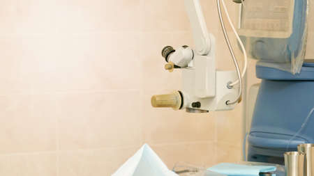 Ophthalmology laser microscope operation. Clinic room with doctor and parient. Gloves and medicine tools.の写真素材