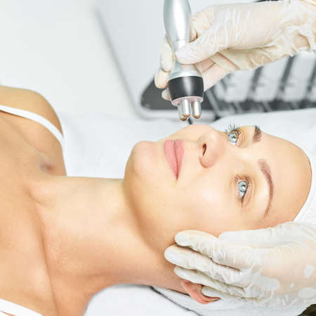 Dermatology skin care facial therapy. Medical spa anto wrinkles procedure. Woman face rejuvenation....