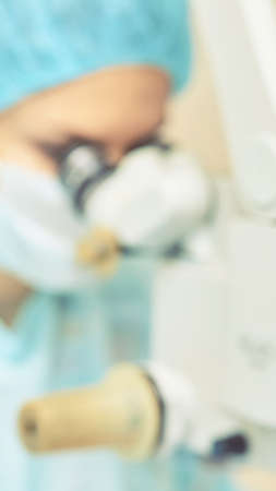 Ophthalmology laser microscope operation. Clinic room with doctor and parient. Blur background....