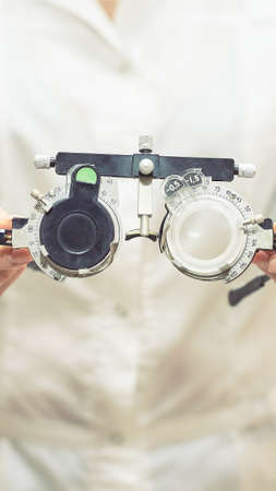 ophthalmologist doctor in exam optician laboratory with female patient. Eye care medical diagnostic. Eyelid treatmentの写真素材