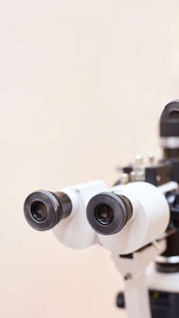 ophthalmologist doctor in exam optician laboratory with female patient. Eye care medical diagnostic....