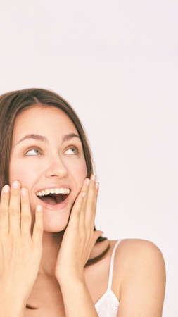 Incredible beauty girl studio portrait. Gorgeous happy energy female model. Oops or winner emotion....