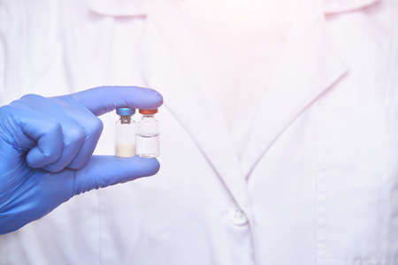Doctor hand holf medicine vaccine. Anti virus health treatment. Medical nurse surgical. Pharmacy laboratory. Reseach center. Covid concept. Safety anaesthetist procedure. White backgroundの写真素材