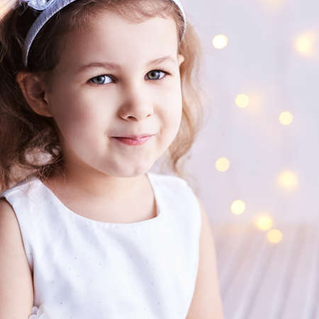 Little cute girl sale portrait. Photography of luxury female child. Happy winner emotion. Fresh person face. Kid eyes. Look at camera.の写真素材