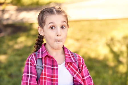 Amazed school girl. Funny child. Overjoyed emotion. Young female kid with backpack. Lifestyle....