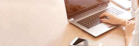 Female student work on laptop. Online lessons.