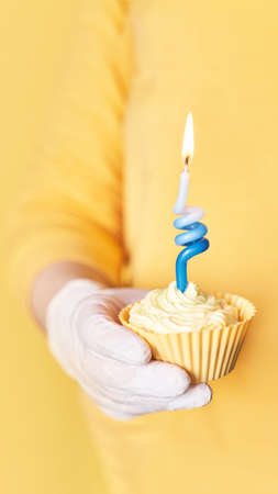 Yellow monochrome bakery. Sustainable cupcake cup.の写真素材