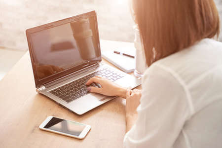 Female student work on laptop. Online lessons.の写真素材