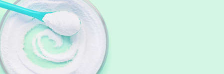 Collagen powder with blue background.