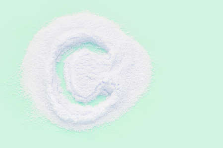 Collagen white powder. Pastel color background. Health product. Woman cosmetics concept. Sport...