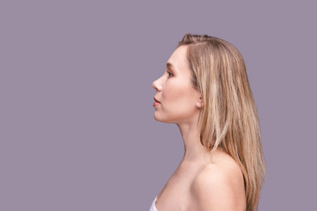 Cosmetology concept. Skin care product. Female portrait. Face mask. Home peeling. Grey background....