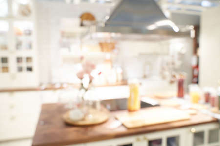 Kitchen blur background. Home indoor room interior. Modern cooking area. Empty coffee shop. Business bakey shop. Light bokeh view. Architecture backdropの写真素材