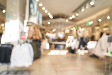 Empty blurry mall background. Defocused wallpaper. Business office interior. Light lifestyle supermarket. Bokeh effect. Holiday backdrop. Copyspace for text. Ready for card or site designの写真素材
