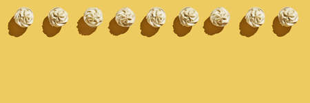 Milky cream cupcake. Birthday sweet bakery. Cookies. Yummy buttercream dessert. Wedding party food. Yellow background. Holiday recipe. Anniversary gourmet. Many different piece. Trendy frameの写真素材