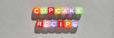 Cupcake quote design. Typography concept. Creative text wallpaper. Phrase grey background. Sweet food concept. Holiday delicious snack. Cube bright lettersの写真素材