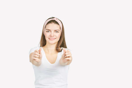 Young woman holding teeth floss. Dental health care concept. Beauty smiling face. Adult mouth...