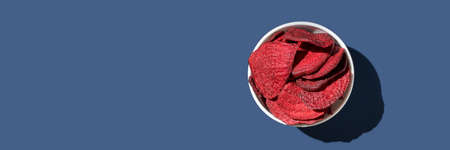 Crispy dried food. Organic tasty chips. Homemade snacks. Sliced beetfood. Healthy vegetables. Trend natural slice. Horizontal banner. Copyspaceの写真素材