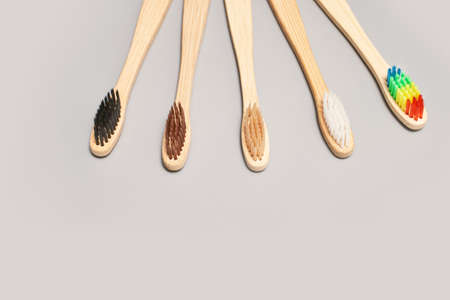 Set of ecology toothbrush on grey background. Different color. Diversity concept. Sustainable mouth...