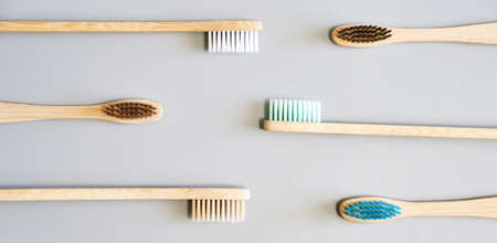Ecology toothbrush on grey background. Different color. Diversity concept. Sustainable mouth...