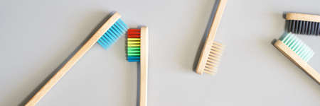 Ecology toothbrush on grey background. Different color. Diversity concept. Sustainable mouth product. Zero waste lifestyle. Organic accessory group. Dental health at home. Biodegradable recycleの写真素材