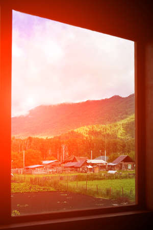 Holistay house. Countryside hiking. Window view. Vacation landscape. Russian Altai mountains....