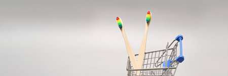 Set of ecology toothbrush on grey background. Different color at shop cart. Diversity concept. Sustainable mouth product. Zero waste lifestyle. Organic accessory group. Biodegradable recycleの写真素材